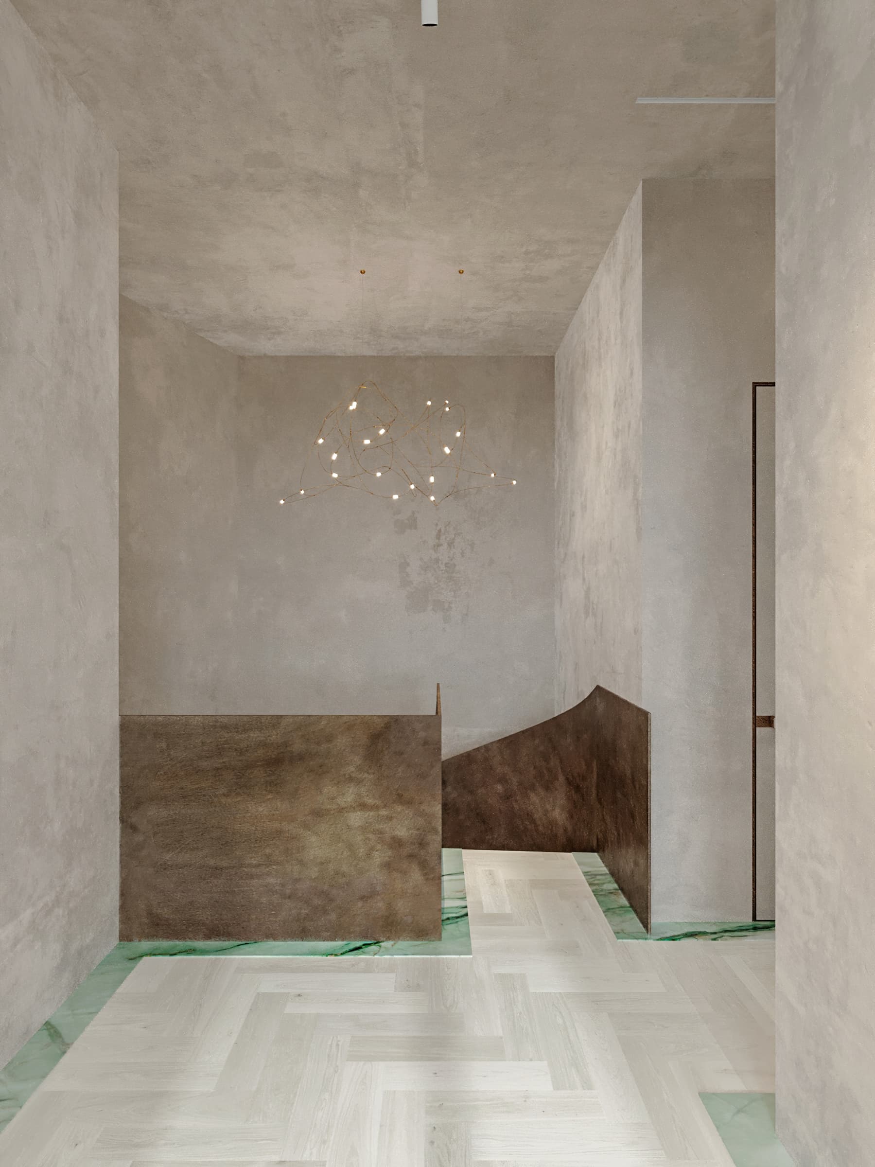 Stairwell with patinated bronze railing